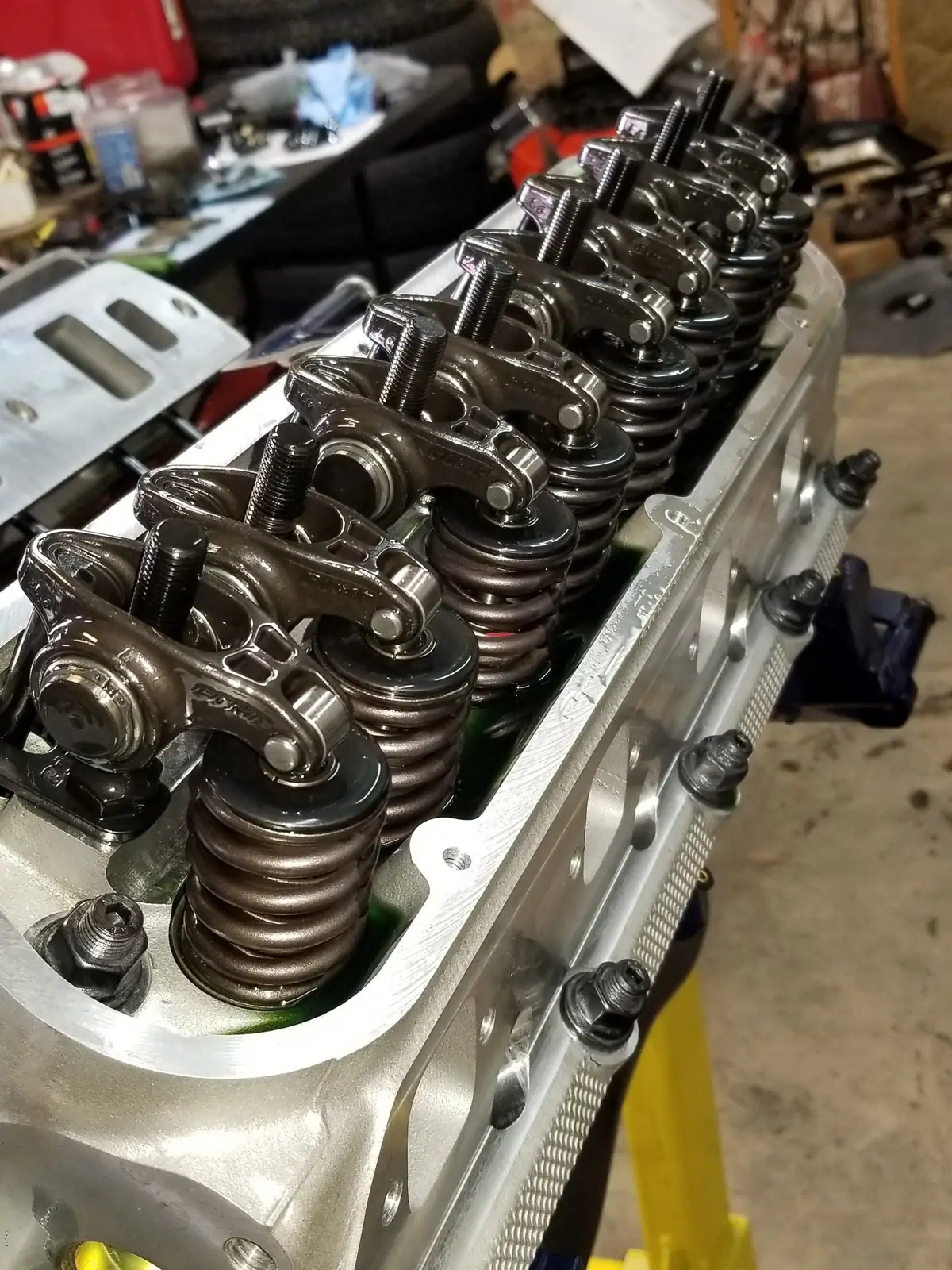 Cylinder head with new valve springs and roller rocker arms