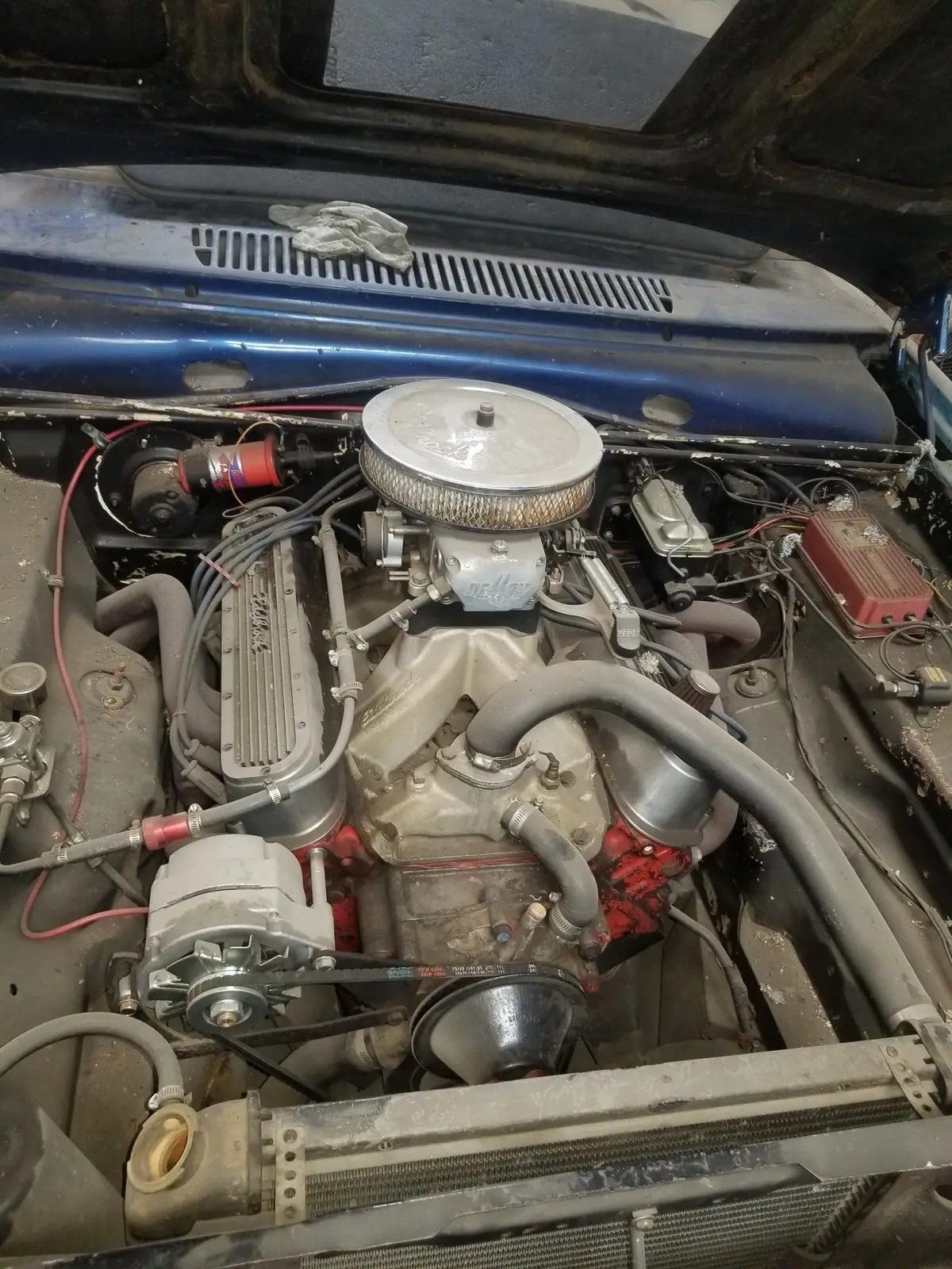 Chevy small-block V8 under the hood of an older car