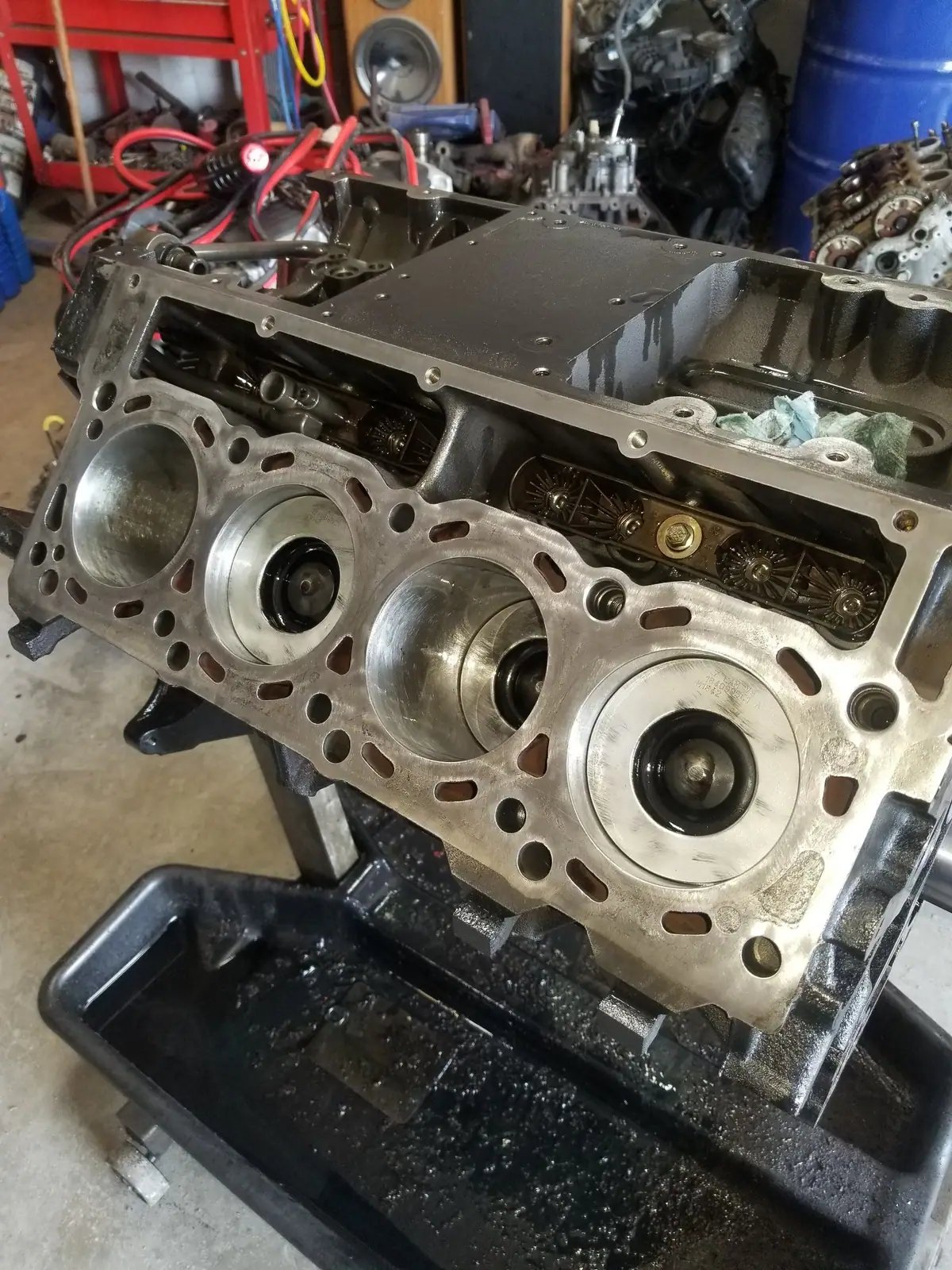V8 engine block with a cylinder head being fitted