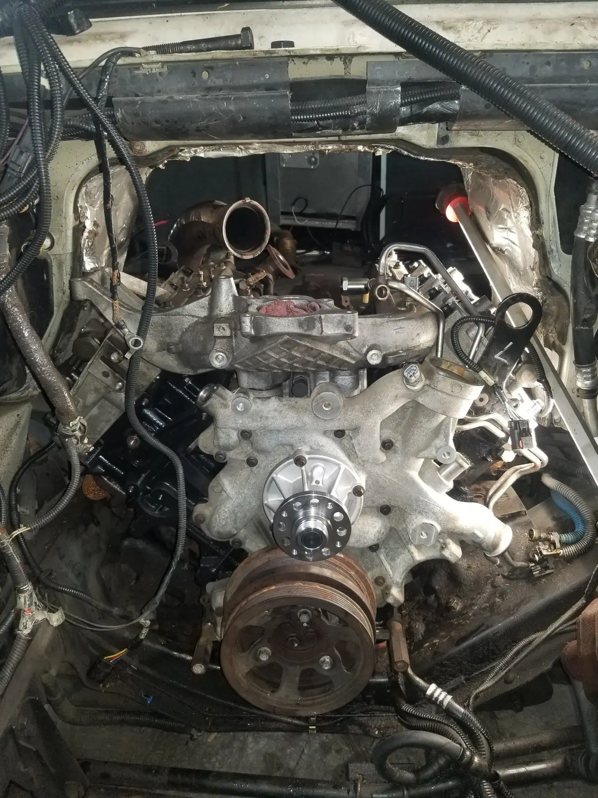 Van engine bay with the intake manifold removed