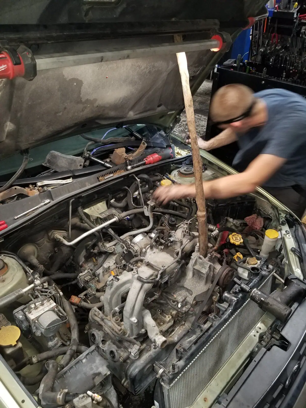 J&W mechanic working on a Subaru engine