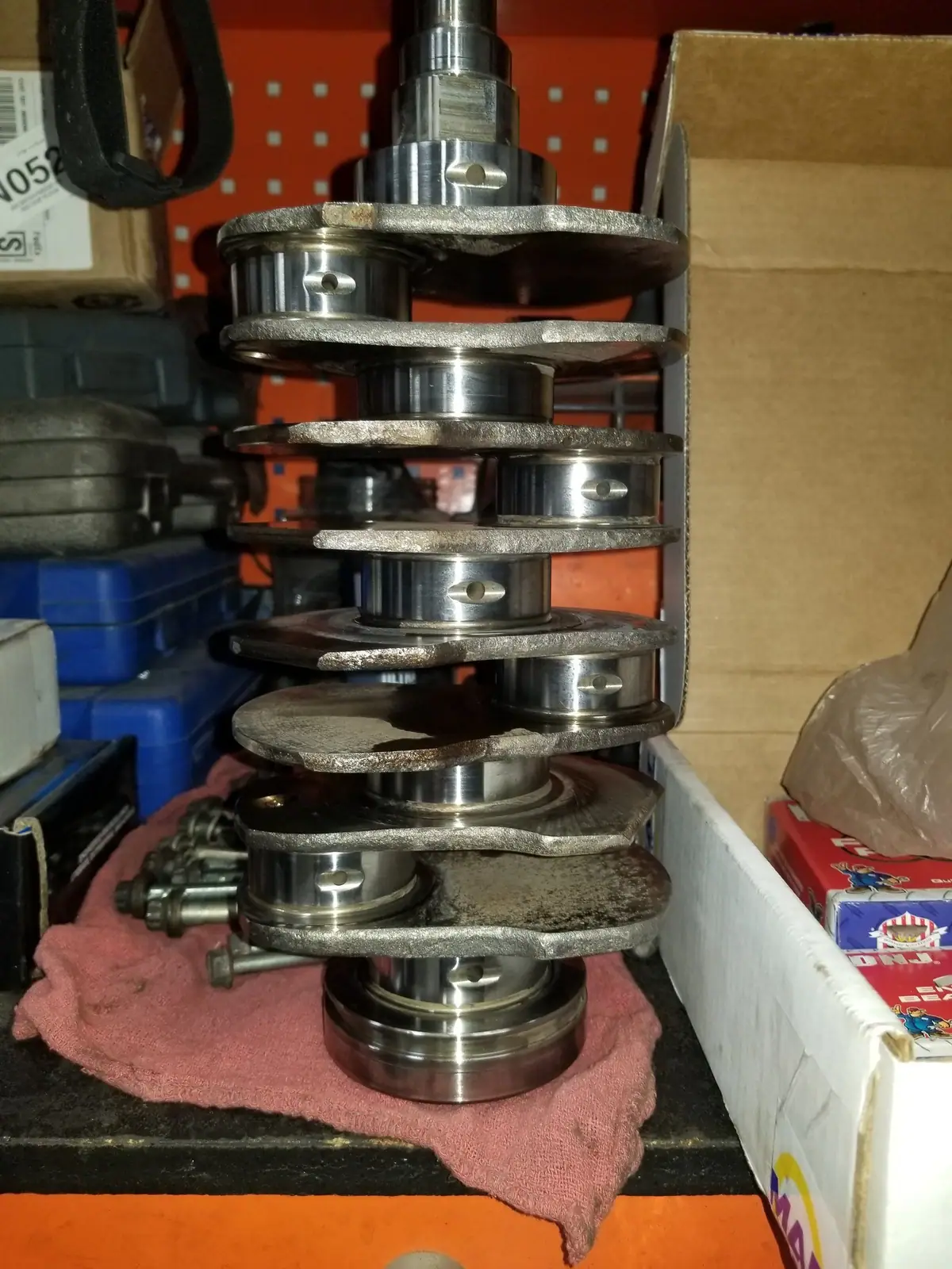 Crankshaft standing on end on the workbench